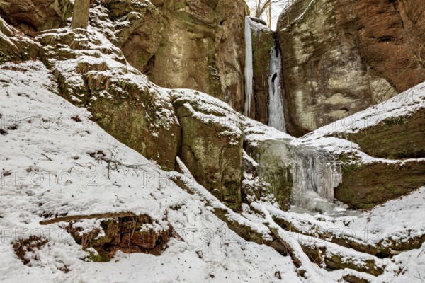 Snow-covered rocks and frozen waterfalls in a wintry landscape, the Drachenschlucht gorge near Eisenach in Thuringia