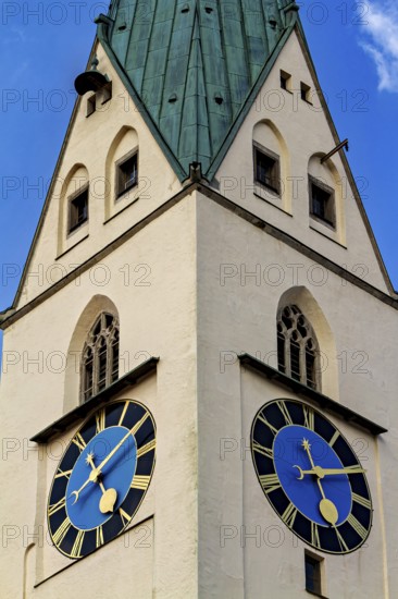Tower with two large clocks and a green roof under a blue sky, The town of Kempten im Allgäu