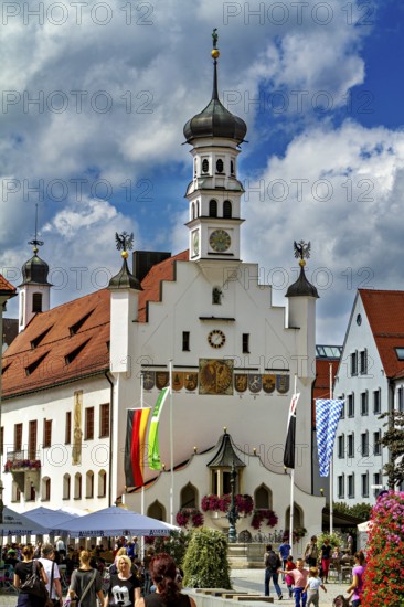Magnificent baroque town hall surrounded by people and flags, The town of Kempten im Allgäu