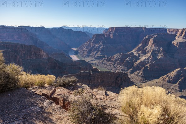 Colorado River runs between rock formations at Guano Point in Grand Canyon West near Peach Springs, Arizona
