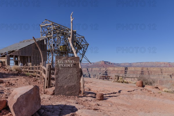 Sign at mining cable head-house tells history of bat guano mining at Guano Point in Grand Canyon West near Peach Springs, Arizona