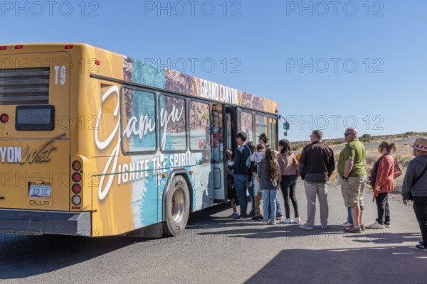 Visitors lined up to take bus transportation from Eagle Point area to Guano Point area at Grand Canyon West near Peach Springs, Arizona