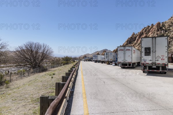 Semi trucks lined up at the Texas Canyon Rest Area on i-10 West near Dragoon, Arizona