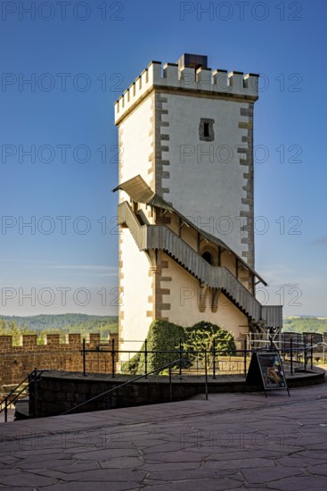 White watchtower with external staircase under a blue sky, Wartburg Castle near Eisenach in Thuringia