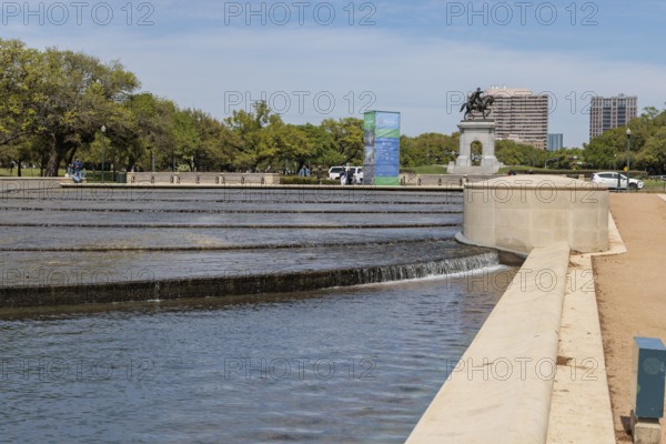 Bronze sculpture of Sam Houston behind the Mary Gibbs and Jesse H. Jones Reflection Pool at Hermann Park in downtown Houston, Texas