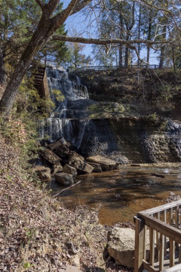 Water diverted from nearby Chunky River to this man-made waterfall to power a grist and cotton mill at Dunn's Falls Park near Enterprise, Mississippi, USA