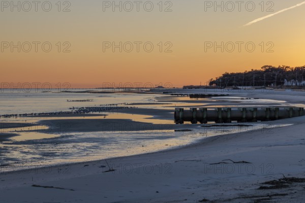 Sunset on the Mississippi Sound along the coastline of Long Beach, Mississippi, USA