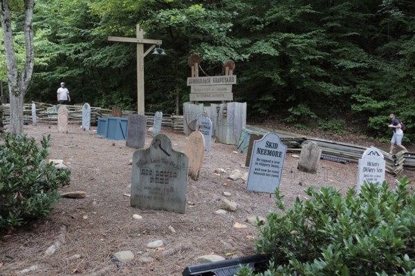 Funny headstones in the Lumberjack Graveyard at the Dollywood amusement park in Pigeon Forge, TN