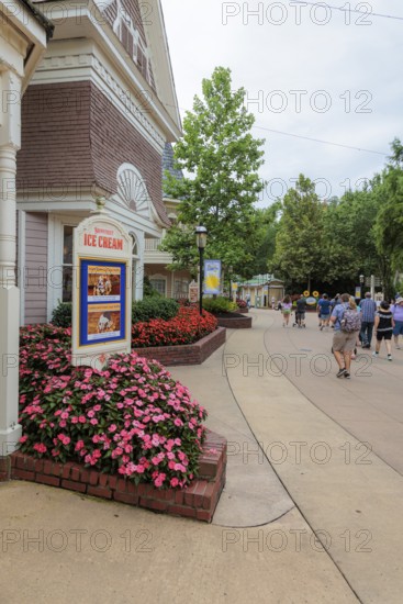 Sign for the Showstreet Ice Cream show surrounded by flowers at the Dollywood amusement park in Pigeon Forge, TN