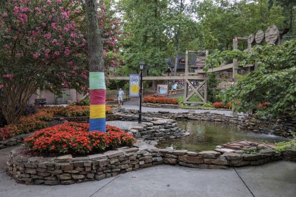 Immaculate landscaping with colorful flowers and water features at the Dollywood amusement park in Pigeon Forge, TN