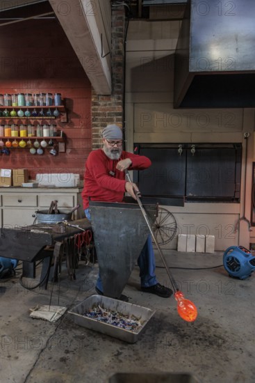 Glass blower demonstrates the art of blowing glass at the Dollywood amusement park in Pigeon Forge, TN