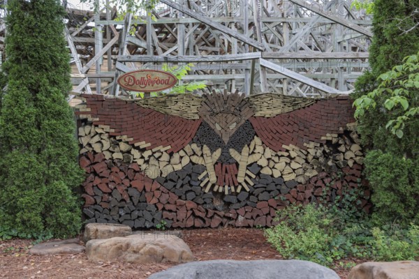 Mural of an eagle formed in stacked wood logs and boards at the Dollywood amusement park in Pigeon Forge, TN