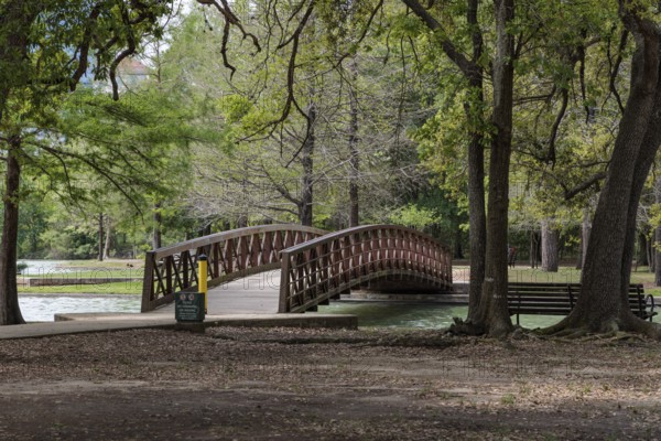 Pedestrian bridge over a part of McGovern Lake in Hermann Park in downtown Houston, Texas