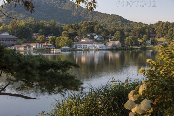 Private homes, Stuart Auditorium, and the Memorial Chapel across the lake at Lake Junaluska, North Carolina