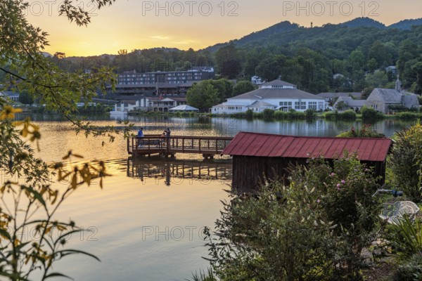Men on the Lake Junaluska Meditation and Fishing pier at sunset in Lake Junaluska, North Carolina