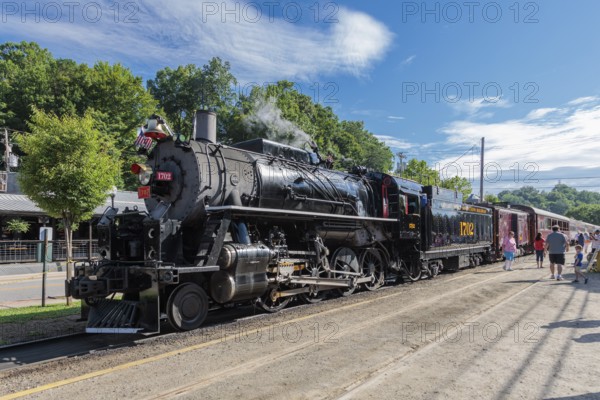 Passengers boarding the Great Smoky Mountains Railroad train pulled by steam engine 1702 on an excursion from Bryson City, North Carolina