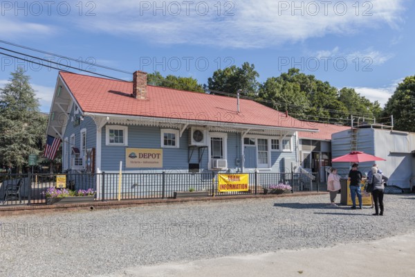 Senior citizens purchasing tickets for the Great Smoky Mountains Railroad in downtown Bryson City, North Carolina