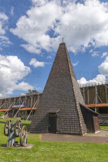 Drilling tower from 1864 for the development of a brine spring, 1000 years of salt production in Bad Sooden, Allendorf, district of Bad Sooden, deep well pump from 1920, town history, historical landmark graduation tower from 1638, wooden construction, 140 metres long, 12 metres high, open-air inhalatorium, blackthorn, brine air, aerosols, respiratory tract healing, therapy, white gold, brine, salt production process, blue sky, Werra-Meissner district, Hesse, Germany