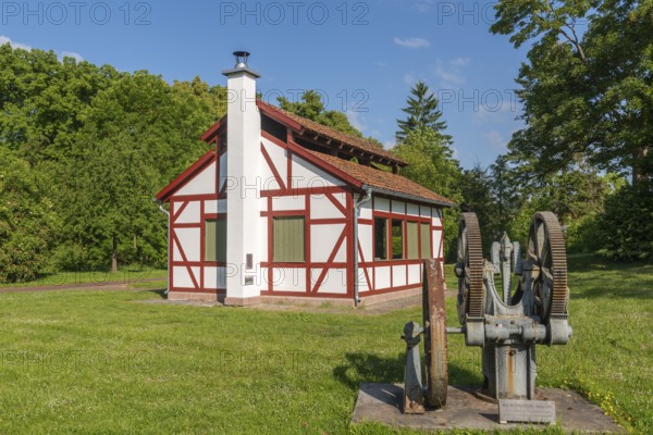 1000 years of salt extraction in Bad Sooden, Allendorf, Bad Sooden district, deep well pump from 1920, boiling dung or boiling house to increase the salt concentration in the water, town history, graduation tower, white gold, brine, historical wealth, lawn, trees, blue sky, Werra-Meissner district, Hesse, Germany