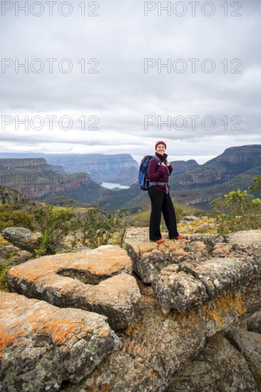 Tourist at Lowveld Viewpoint, view of the Blyde RIver gorge, canyon landscape, Blyde River Canyon, Panorama Route, Mpumalanga, South Africa