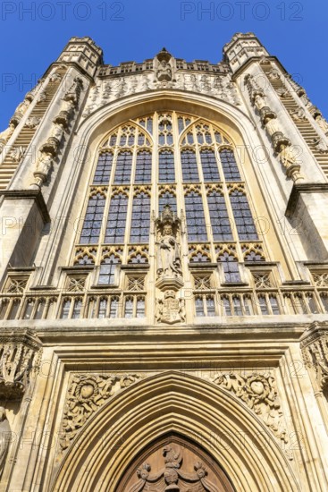 Looking up at frontage of Bath Abbey church, city of Bath, north east Somerset, England, UK