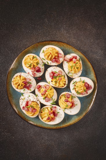 Spicy, stuffed ramen eggs, with bacon and green onions, homemade, no people