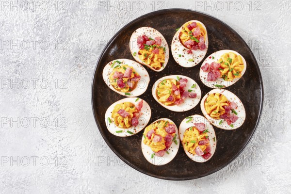 Spicy, stuffed ramen eggs, with bacon and green onions, homemade, no people