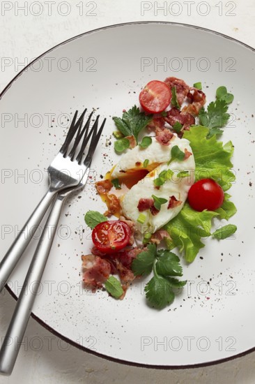 Poached egg, with bacon and vegetables, breakfast, homemade