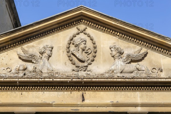 Stonework details pediment above entrance to King's and Queen's Baths, city of Bath, north east Somerset, England, UK