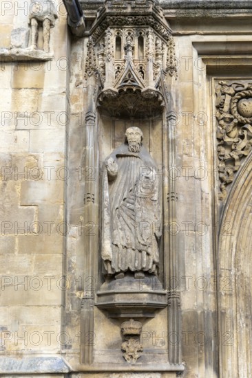 Carved stonework statue of Saint Peter, front of Abbey church, city of Bath, north east Somerset, England, UK