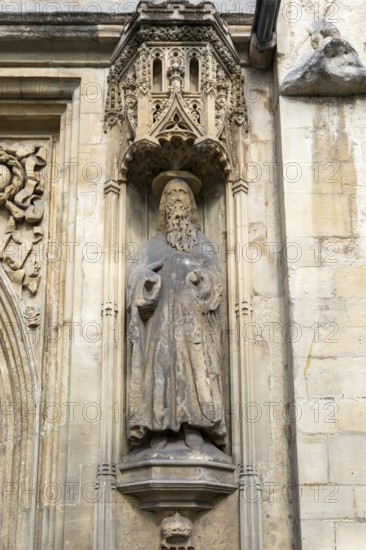 Carved stonework statue of Saint Paul, front of Abbey church, city of Bath, north east Somerset, England, UK