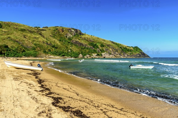 Speedboats in the sea at Bonete beach on Ilhabela island on the north coast of Sao Paulo, Ilhabela, Sao Paulo, Brazil