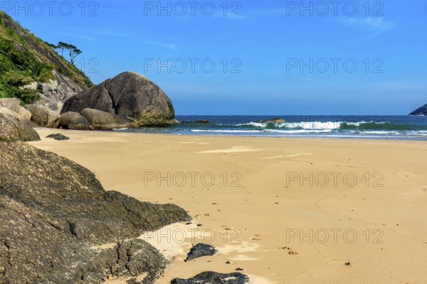 The rocks and the sea at Bonete beach on the island of Ilhabela on the coast of Sao Paulo, Ilhabela, Sao Paulo, Brazil