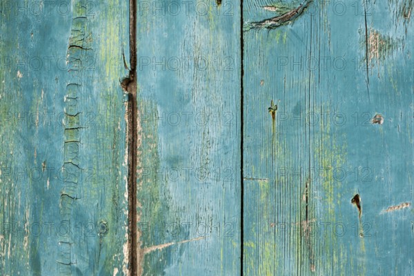 Old wooden door with peeling paint, texture, background, Montenegro, Balkans
