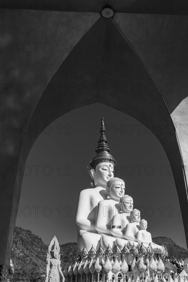 Round arch pavilion, the five-headed Buddha statue in the back, black and white photo, Wat Phra That Sorn Kaew Buddhist temple complex, Phetchabun province, Thailand