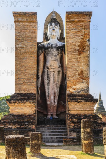 Stone Buddha statue in the historic Wat Mahathat Buddhist temple complex, historical park, Sukhothai, Sukhothai province, Thailand
