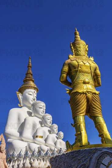 Five-headed Buddha statue with a gilded temple guard in front of it, Wat Phra That Sorn Kaew Buddhist temple complex, Phetchabun province, Thailand