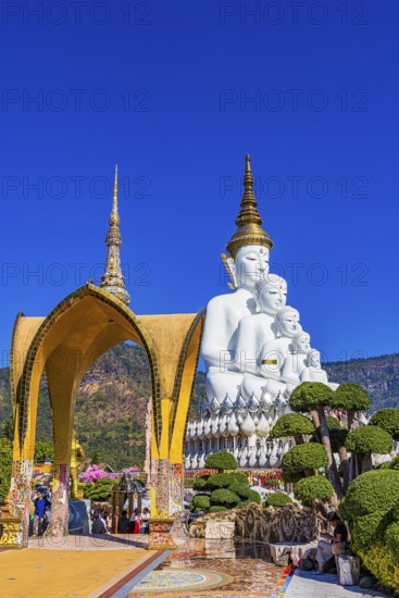 Round arch pavilion decorated with colorful mosaics and glass works of art, the five-headed Buddha statue at the back, Wat Phra That Sorn Kaew Buddhist temple complex, Phetchabun province, Thailand