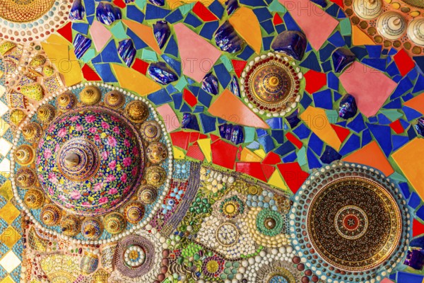 Wall covering with colorful mosaic tiles and incorporated bowls, Buddhist temple complex Wat Phra That Sorn Kaew, Phetchabun province, Thailand