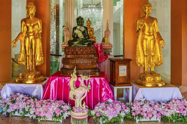 Shrine with gilded Buddhist statues in the main pagoda, Wat Phra That Sorn Kaew Buddhist temple complex, Phetchabun province, Thailand