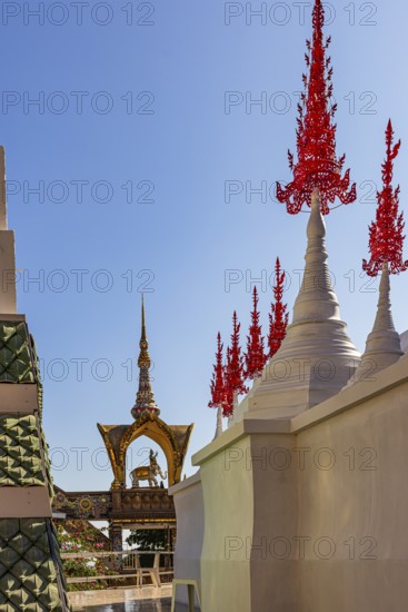 Red decorated tops of a temple complex, Buddhist temple complex Wat Phra That Sorn Kaew, Phetchabun province, Thailand