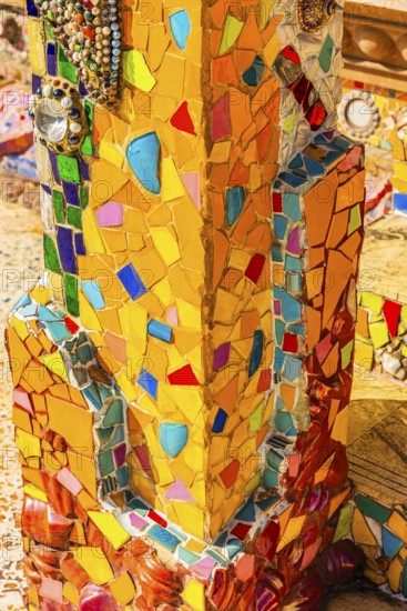 Column decorated with colorful mosaics, Buddhist temple complex Wat Phra That Sorn Kaew, Phetchabun province, Thailand