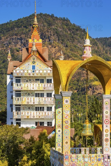 Bell tower decorated with mosaic and glass works of art, Buddhist temple complex Wat Phra That Sorn Kaew, Phetchabun province, Thailand