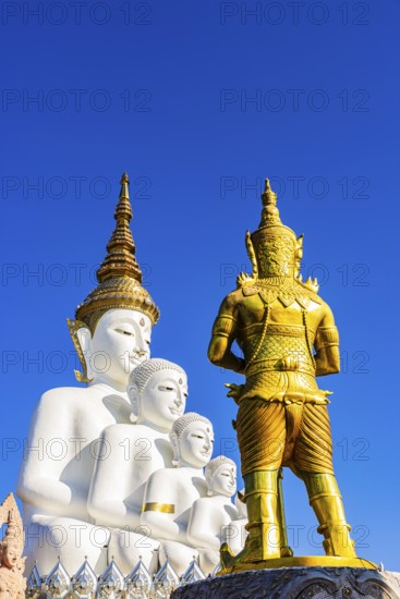 Five-headed Buddha statue with a gilded temple guard in front of it, Wat Phra That Sorn Kaew Buddhist temple complex, Phetchabun province, Thailand