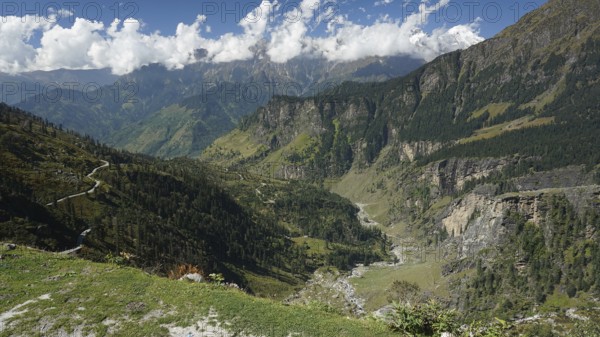 View of winding mountain roads on the Manali-Leh Highway and green slopes, trekking Ladakh, Himachal Pradesh, Himalayas, India