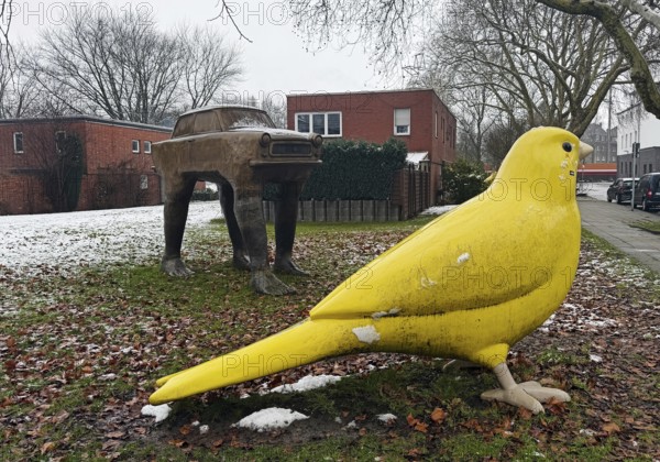 Very large yellow canary and trobant sculpture by David Cerny' at the Holy Spirit Church, Kunstraum Heilig Geist, Essen, Ruhr region, Germany
