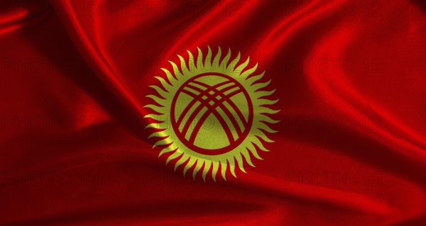 National flag of Kyrgyzstan with cloth texture. Kyrgyz flag with realistic texture background