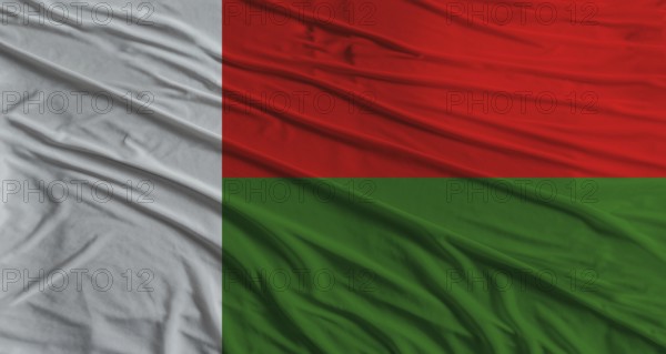 Malagasy flag waving. Flag of Madagascar with cloth texture
