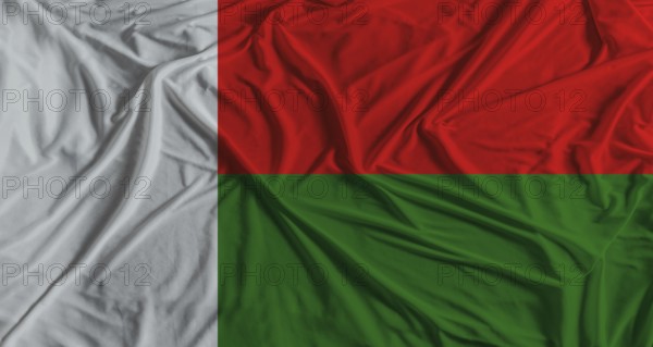 Madagascar flag with fabric texture background. National flag of Madagascar with cloth texture