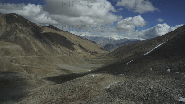 Sublime mountain landscape with dramatic sky and vast valley, trekking in Ladakh, Himalayas, India